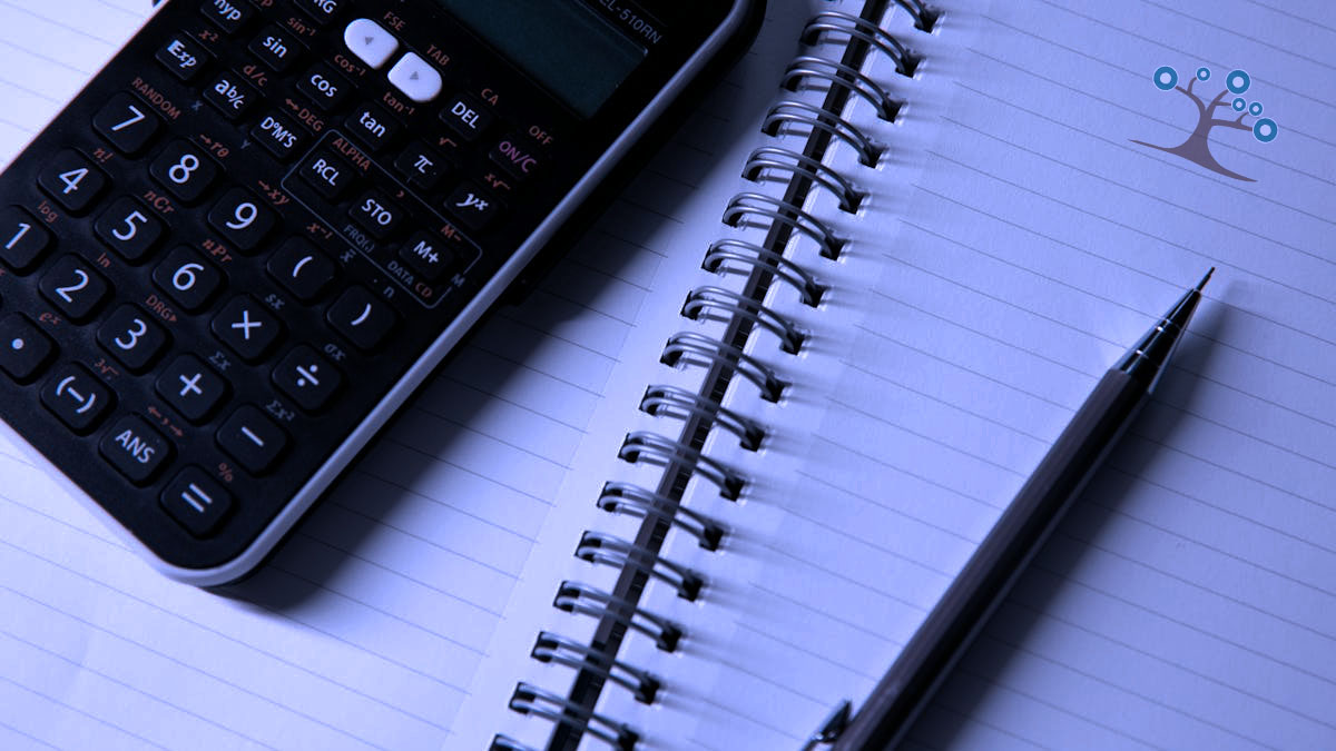 A calculator sitting on a notepad with a pencil