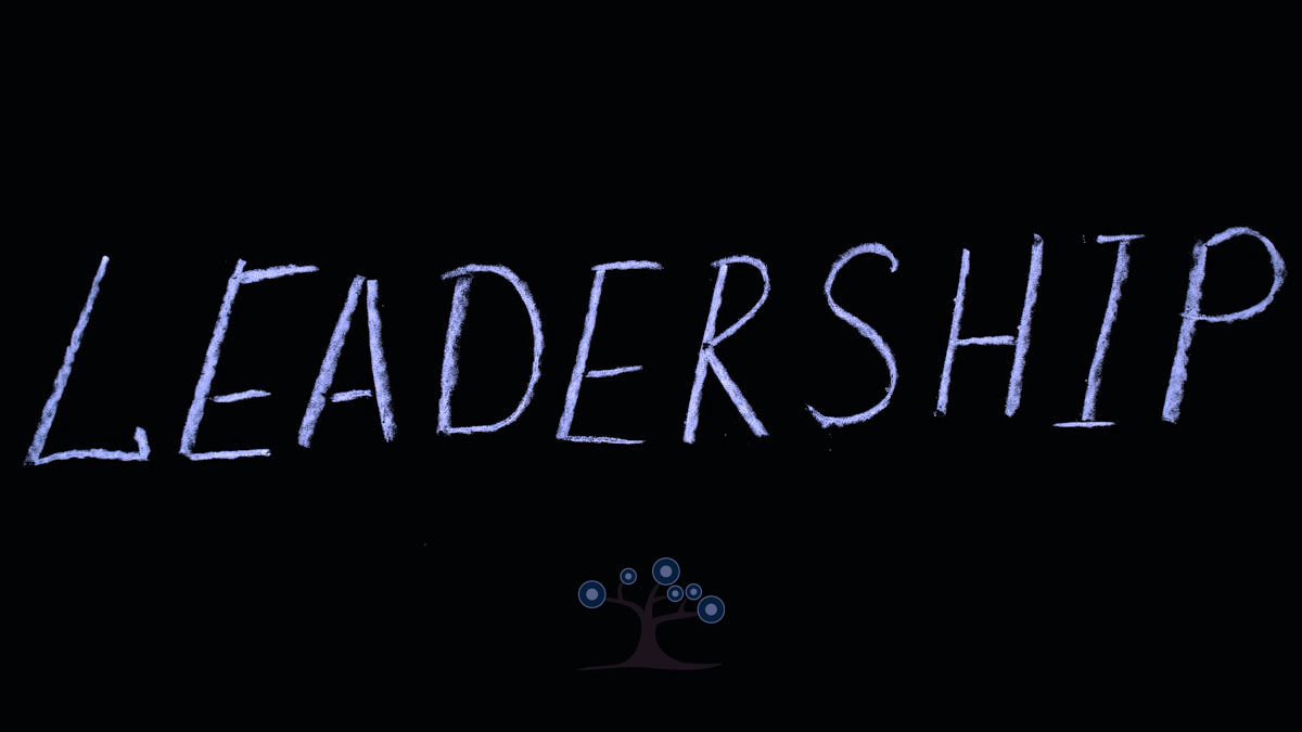 The word Leadership written in chalk on a black surface.