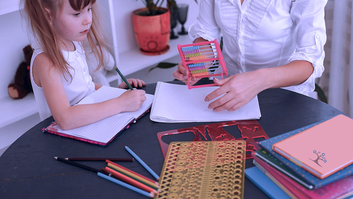 A young girl sitting at a table with books on it, taking notes in a notebook.