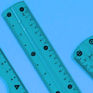 Three rulers on a blue background