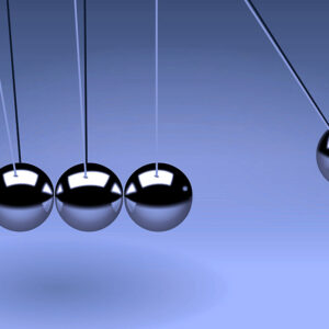 A pendulum ball swinging toward four other balls.