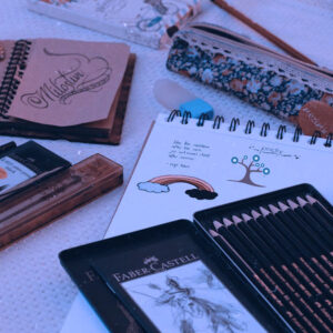 Art supplies laying on a fabric